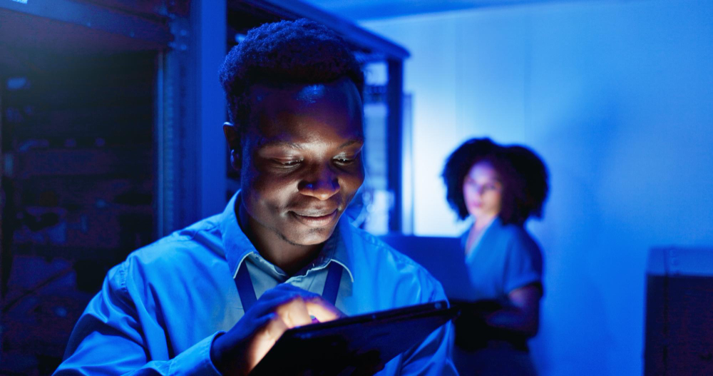 Two community members working together on a tablet