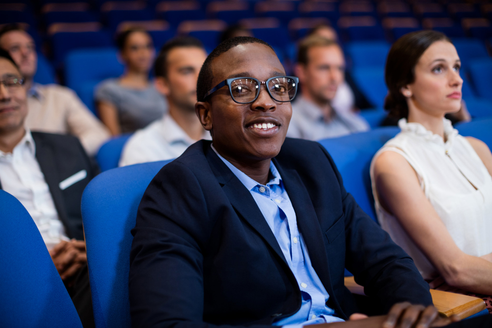 Community members listening during a talk