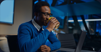 A client taking a coffee break at their desk